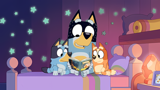 Papá leyendo un cuento a sus hijos